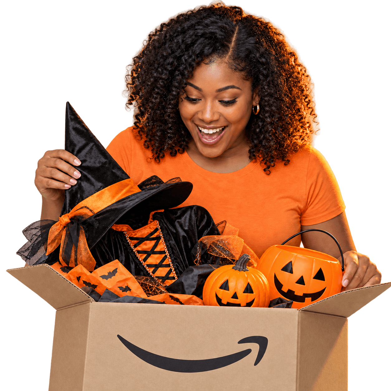 Delighted Mr. Ship It customer unpacking a Halloween costume, hat and pumpkins